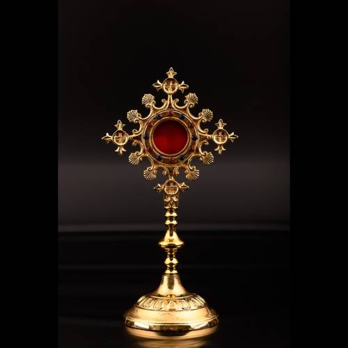 Golden plated reliquary with red and blue stones