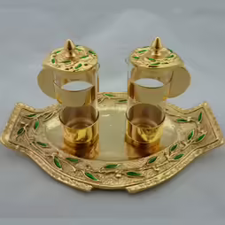 Gilded cruet set with green enamels
